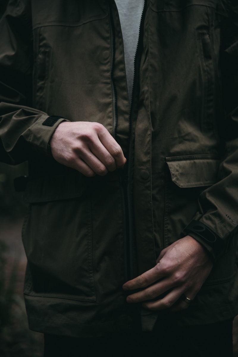 Olive technical rain shell, zipper detail